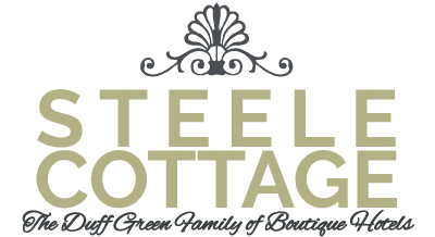 Logo for Steele Cottage, featuring elegant typography and decorative elements.